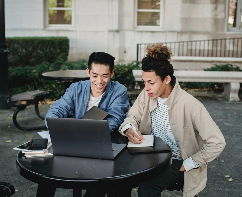 Students using laptop for studies